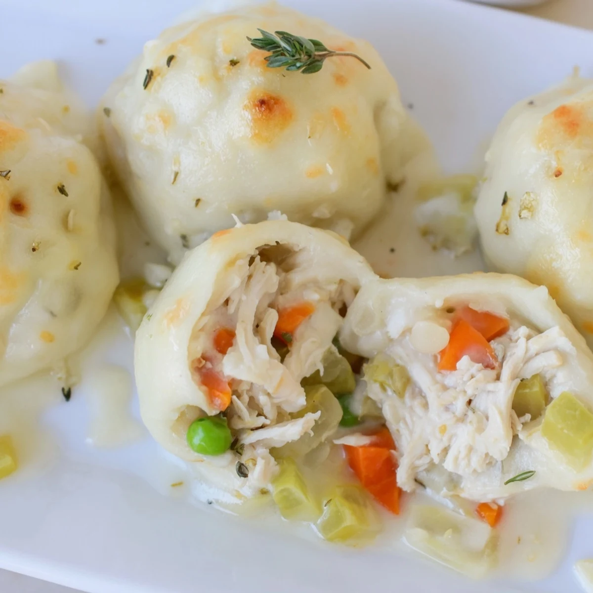 Golden, bubbly Chicken and Dumplings Casserole, a warm, comforting American classic, ready to serve.
