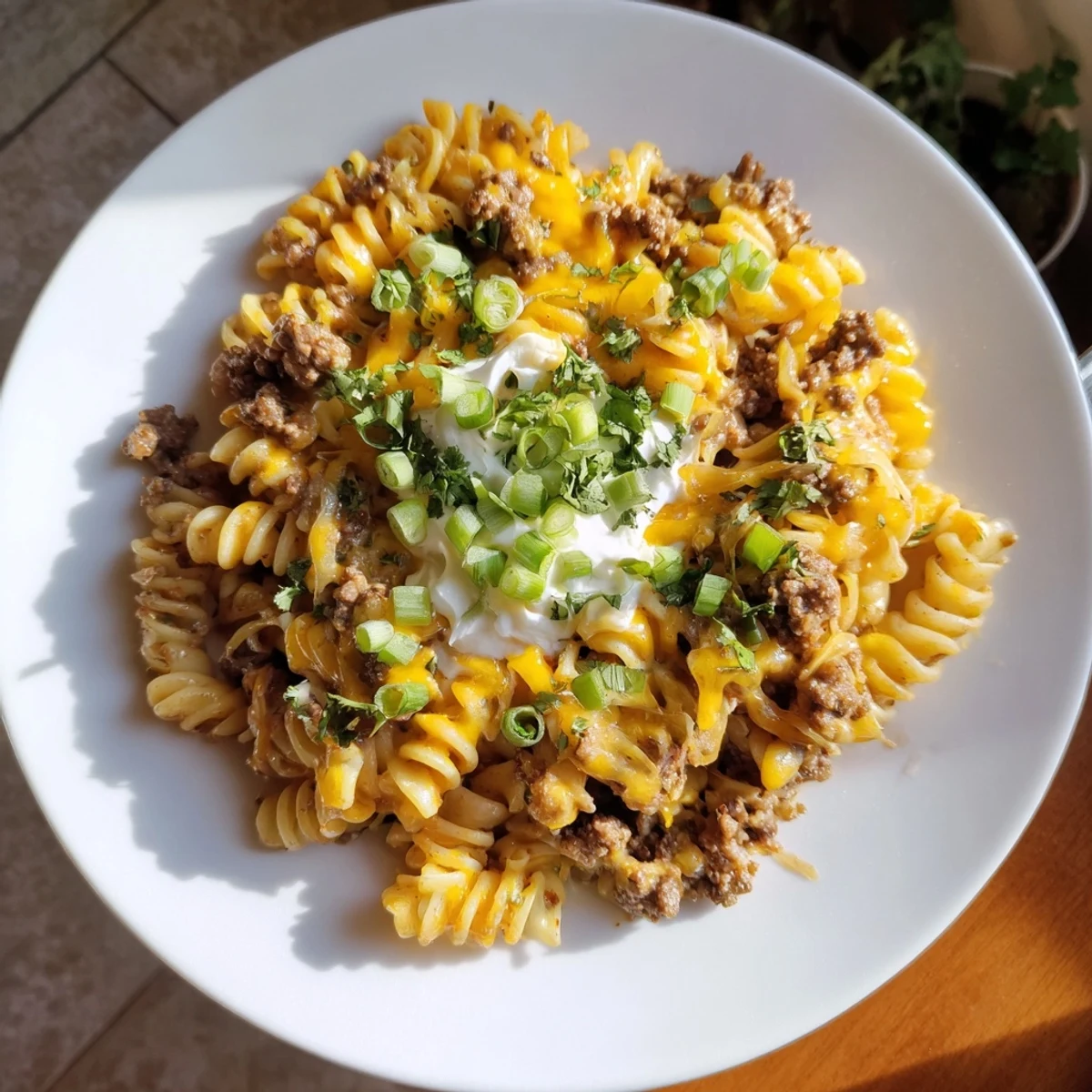 Tender Cheesy Taco Pasta Skillet topped with melted cheddar, ready for a satisfying dinner.