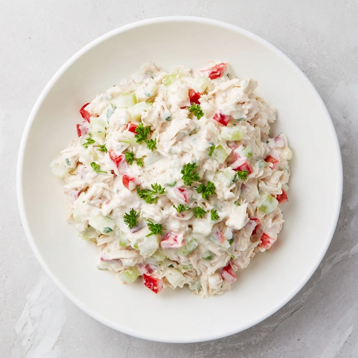 Chunky Canned Chicken Salad with Mrs. Dash, ready to eat, featuring diced veggies and herbs.