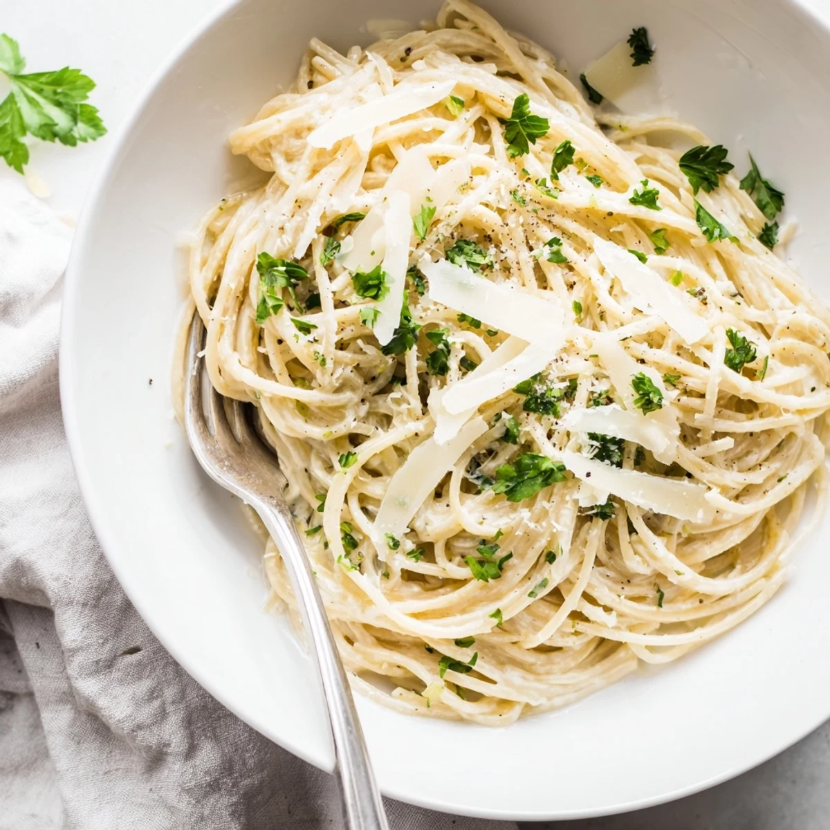 Elegant Lemon Ricotta Pasta topped with extra Parmesan, lemon zest, and a crack of black pepper.