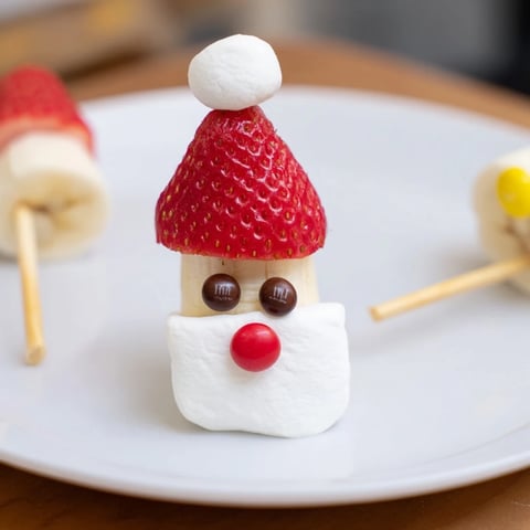 Close-up of vibrant Banana Santa Snack Sticks; festive, sweet fruit skewers for a holiday treat.