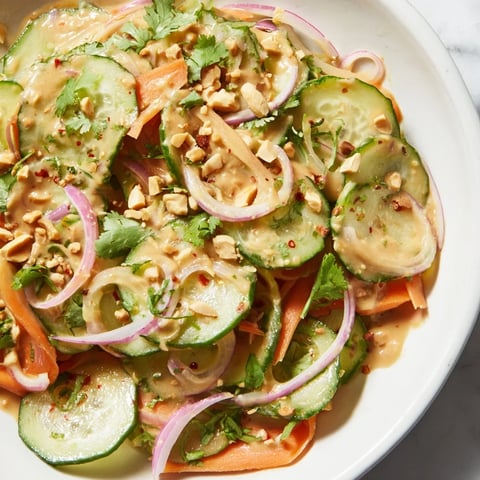 Fresh Thai-Style Peanut Cucumber Salad, vibrant with cilantro and peanuts, a perfect side dish.