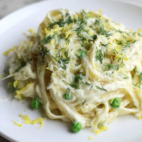 Creamy Dill Pasta with a rich, velvety sauce, fresh dill garnish, and penne pasta noodles.
