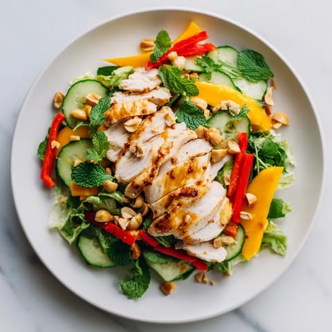 Vibrant Thai Mango Chicken Salad with juicy mango and tender chicken, ready to enjoy.
