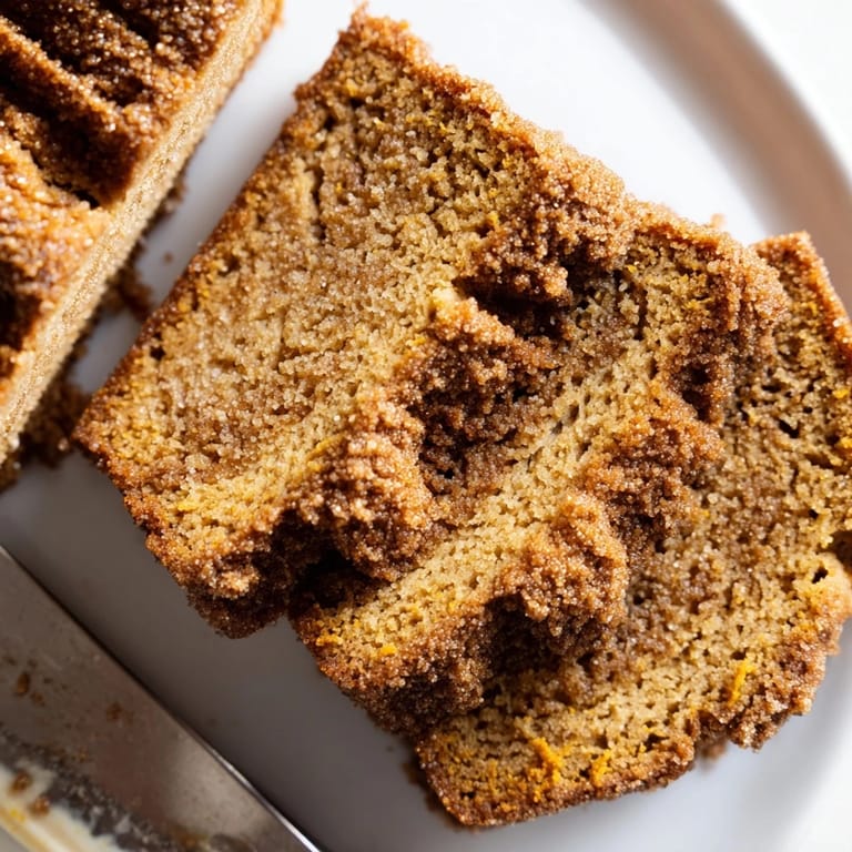 Golden-brown cinnamon-ginger pumpkin biscuit loaf waiting to be enjoyed with butter.  