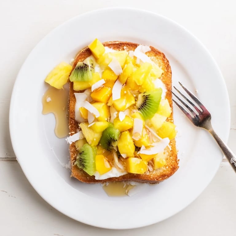 Vibrant yogurt-custard toast recipe featuring tropical fruits and a golden crust.  