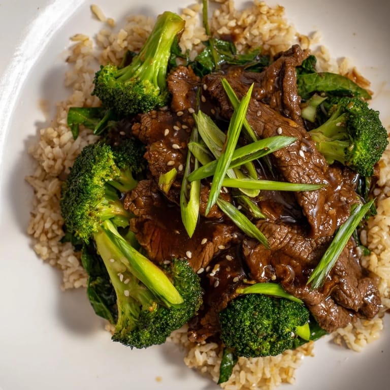Delicious Slow-Cooker Beef & Broccoli, showcasing vibrant green broccoli and glistening, slow-cooked beef.