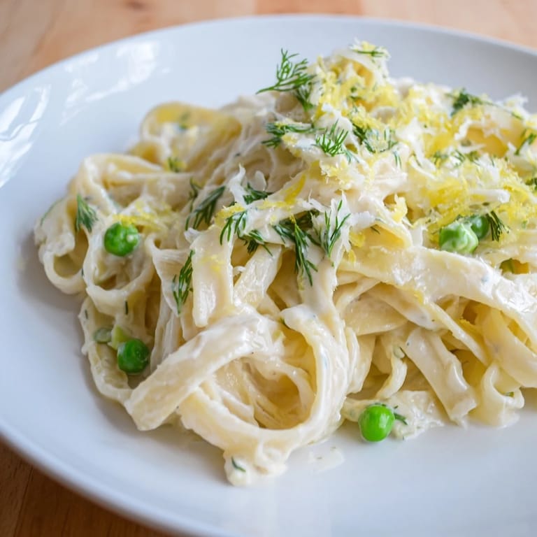 A close-up of the finished Creamy Dill Pasta, showcasing the creamy sauce and fresh dill.