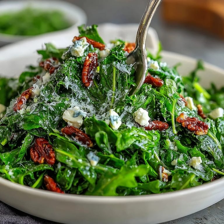 Tangy lemon vinaigrette coats fresh arugula leaves, topped with delicate Parmesan shavings for a zesty Italian salad.